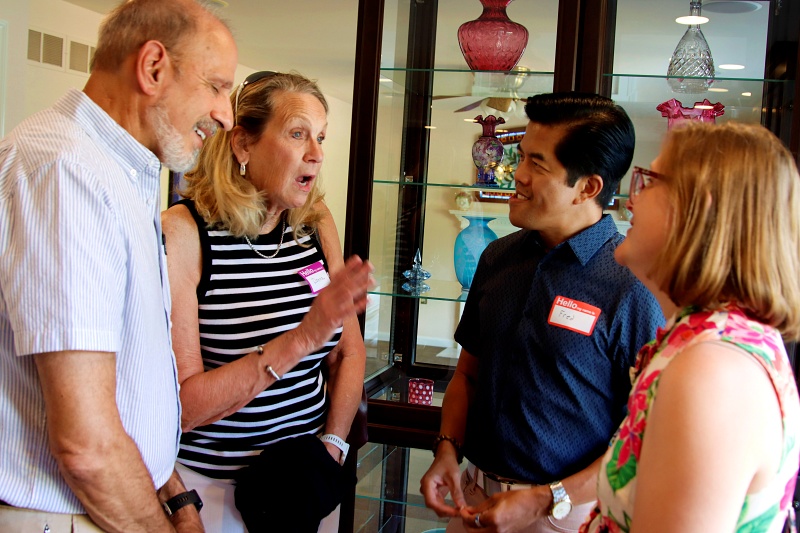 CCDC members meeting and talking with each other at a club gathering